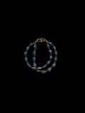 Blue Dyed Vaijayanti Seed Bracelet with Brass Discs
