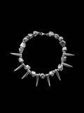 Silver rock and tooth necklace