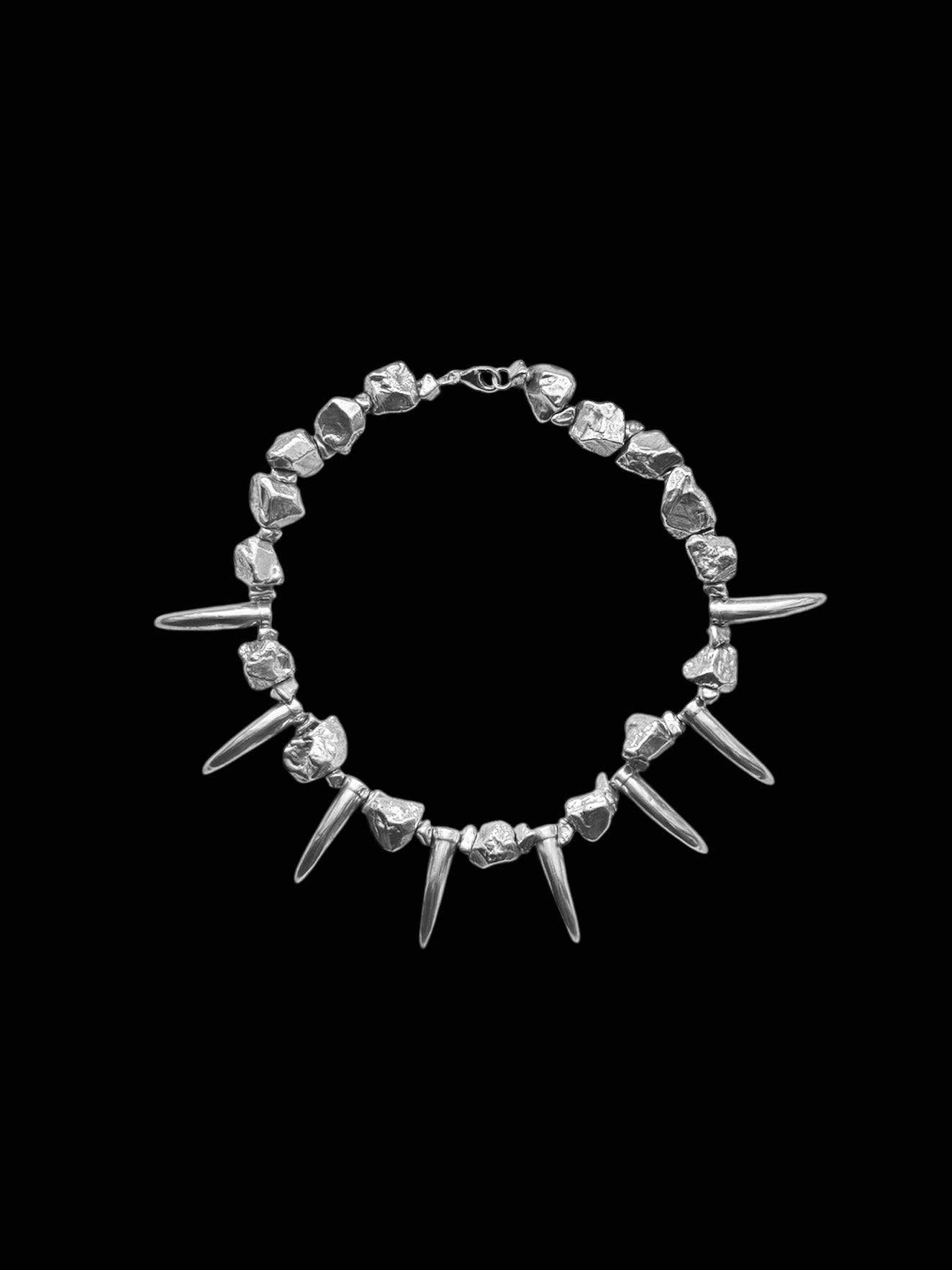 Silver rock and tooth necklace