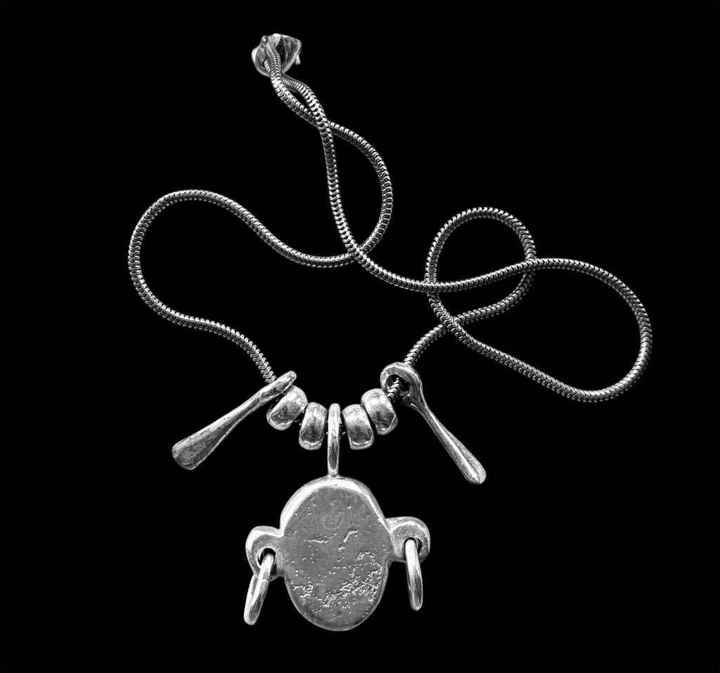Silver Head Pendant on a Silver Snake Necklace Chain